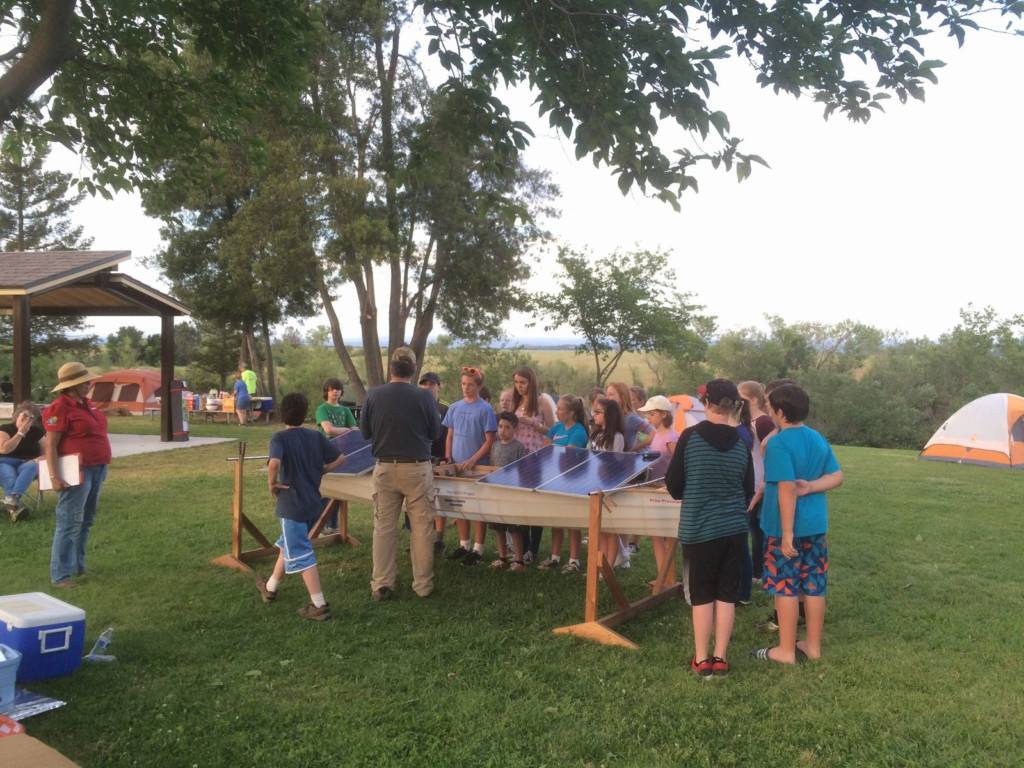 Students prepping their boat for the solar regatta