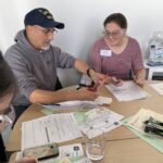 Two teachers discussing a science experiment