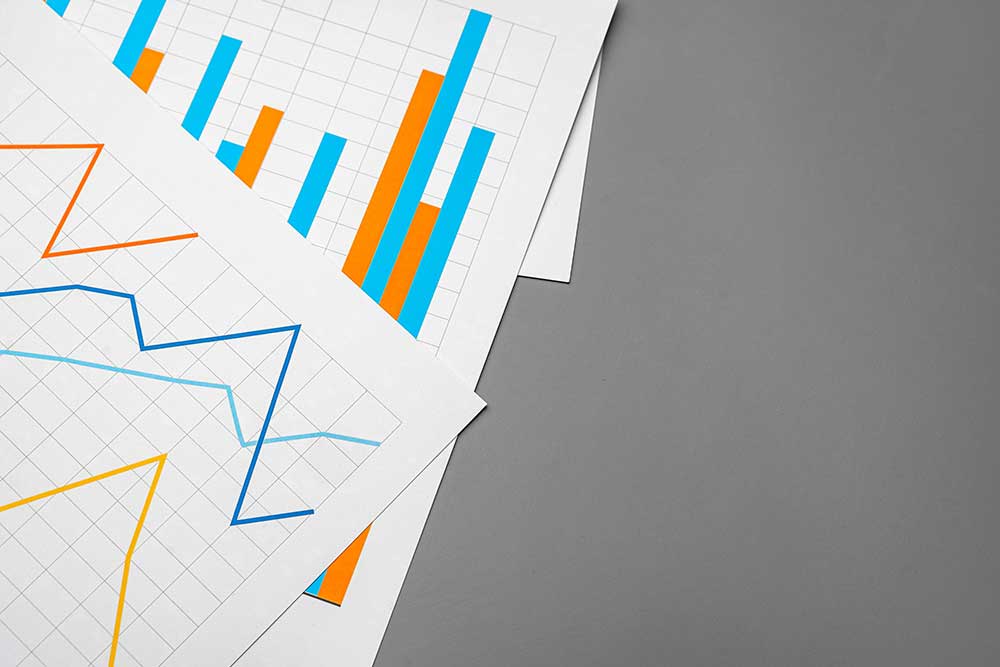 colored financial charts on paper