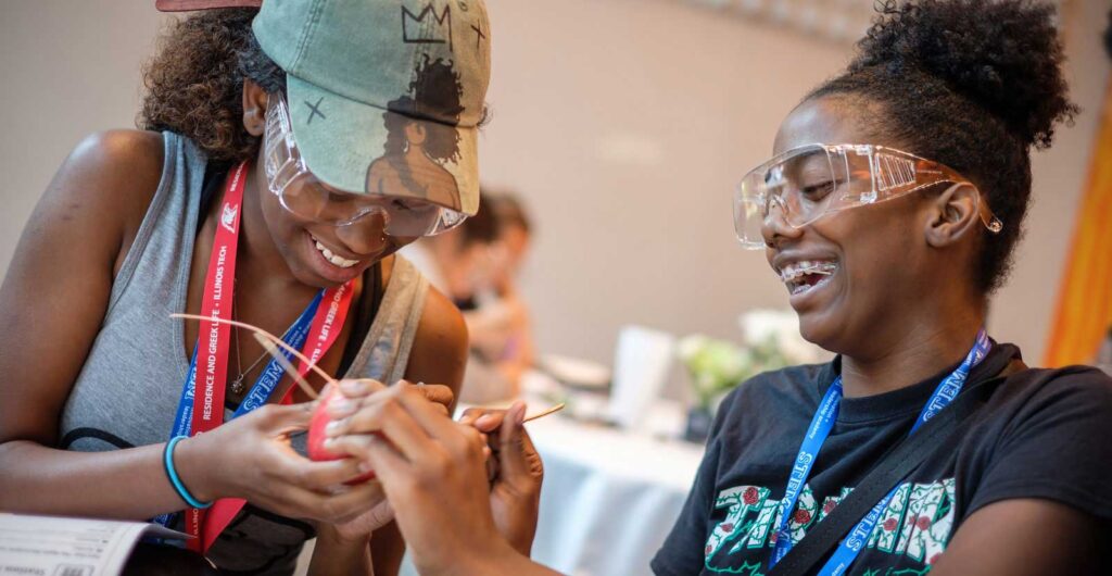 two girls doing a science experiment