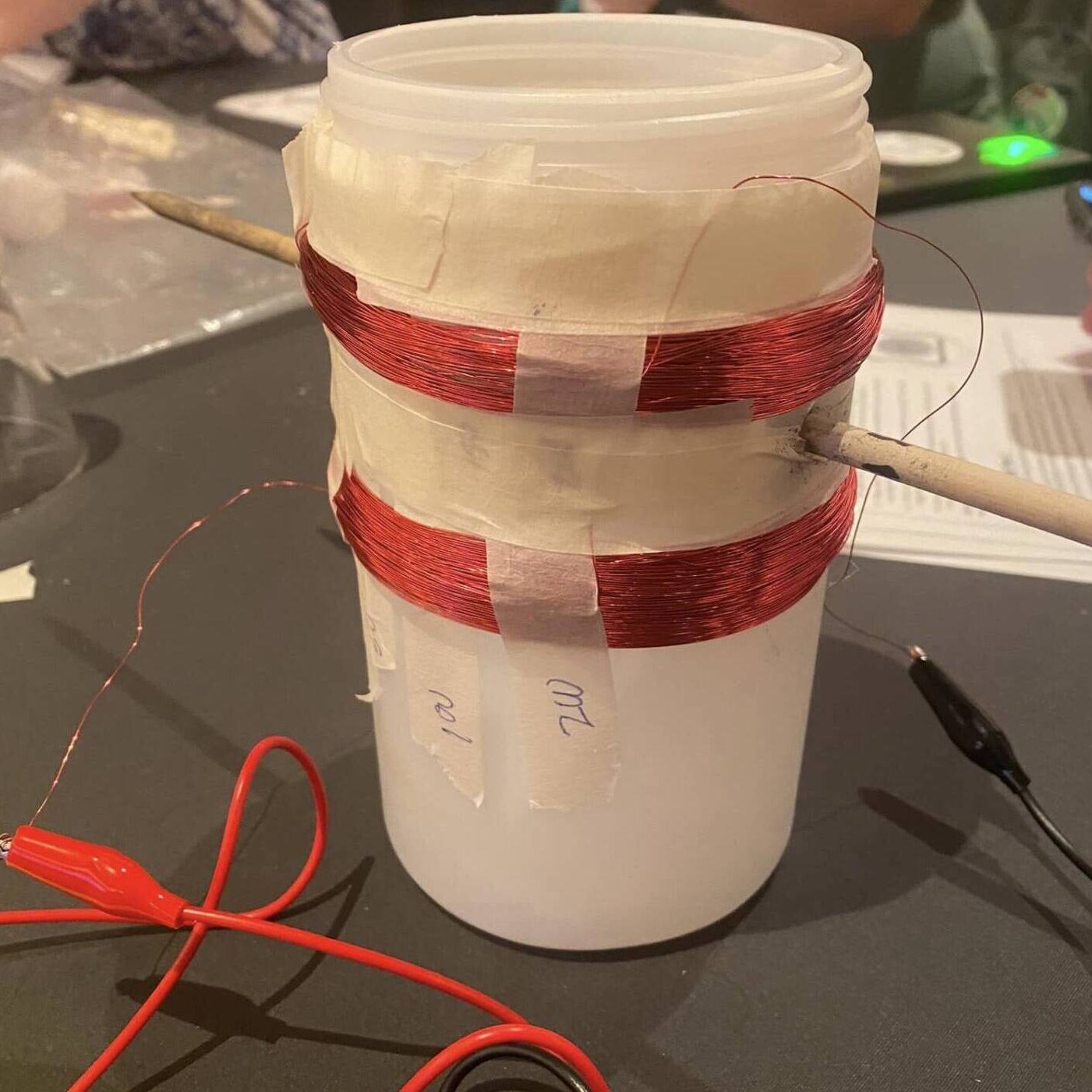 Cup with electrical harness around it