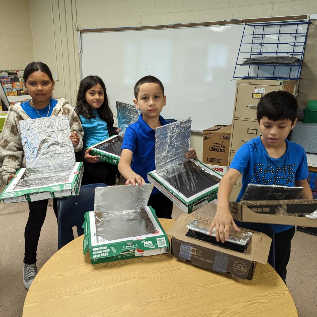 Students Holding science experiments they made