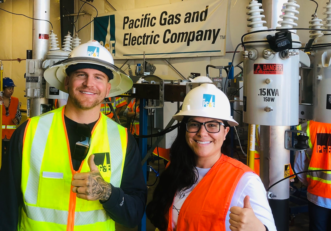 A high school student and PG&E worker inside a power plant