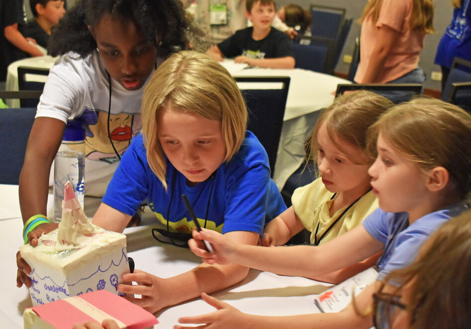 Primary school students working on a science experiment