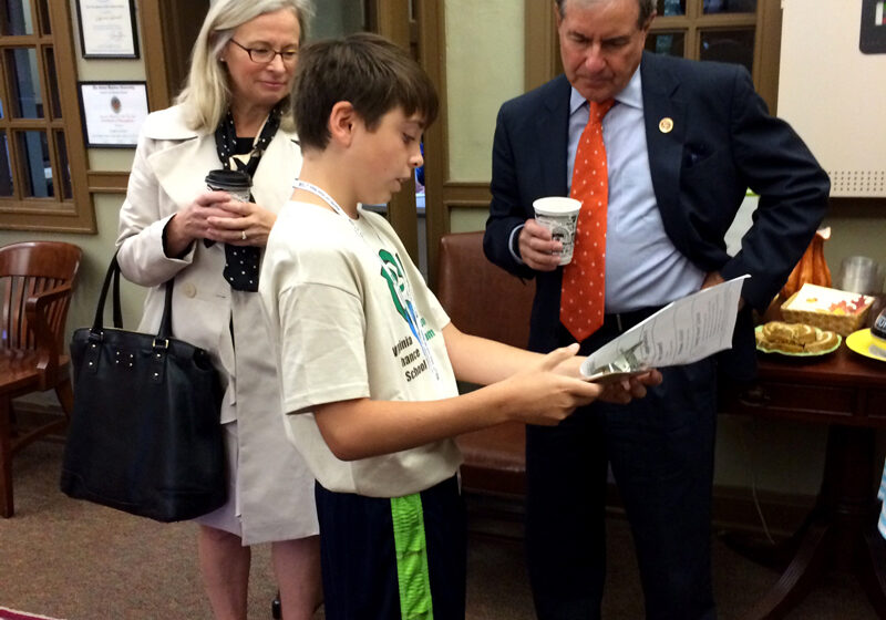 Congressman Yarmuth meeting with a student