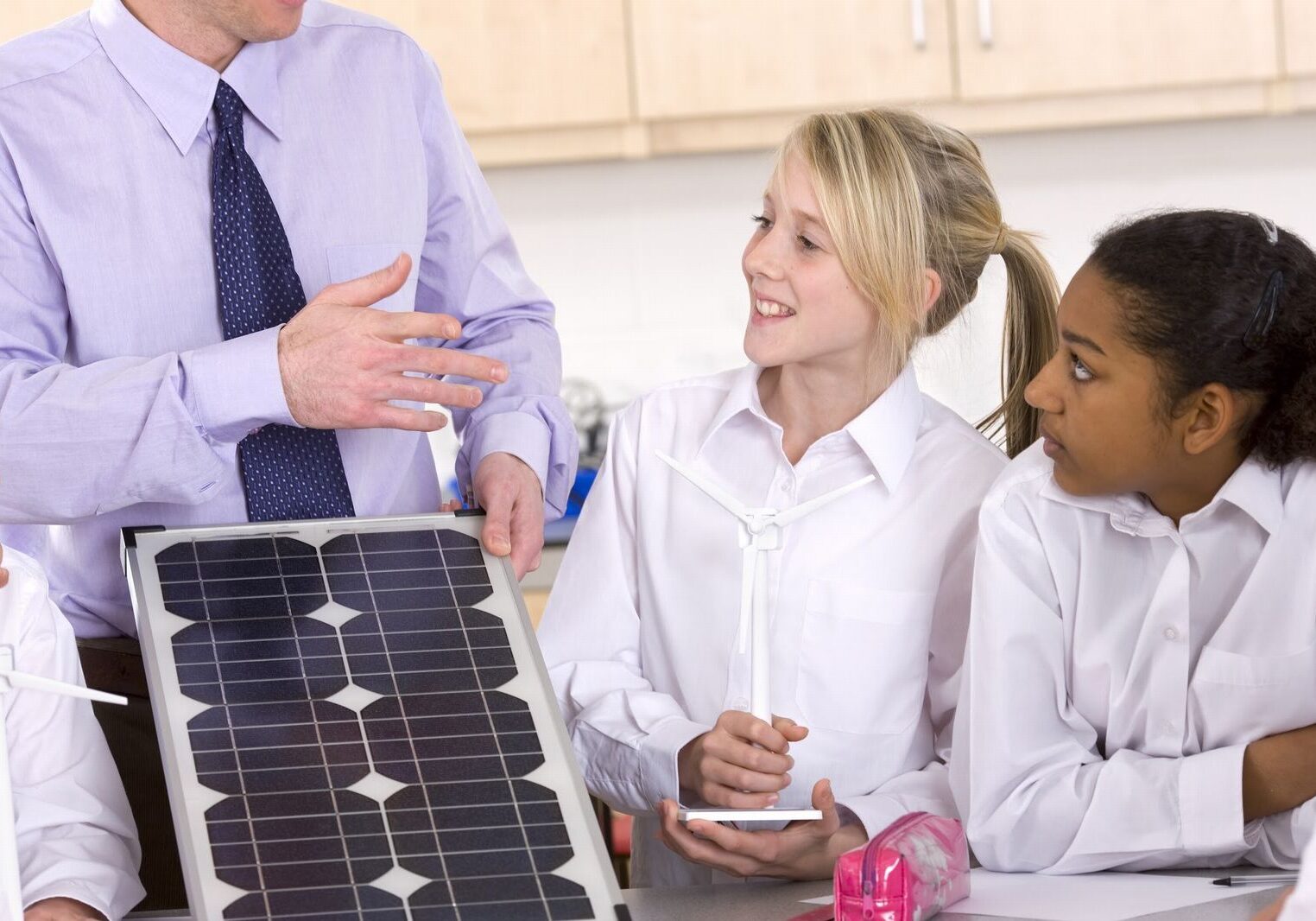 Teacher teaching solar to students